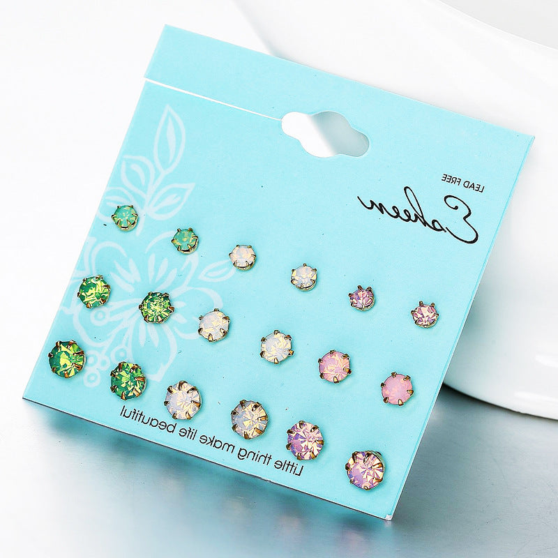 9 pairs of earrings in different sizes and colors