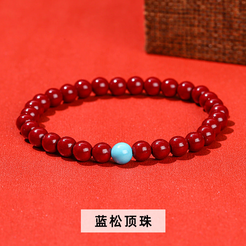 Cinnabar bead bracelet.