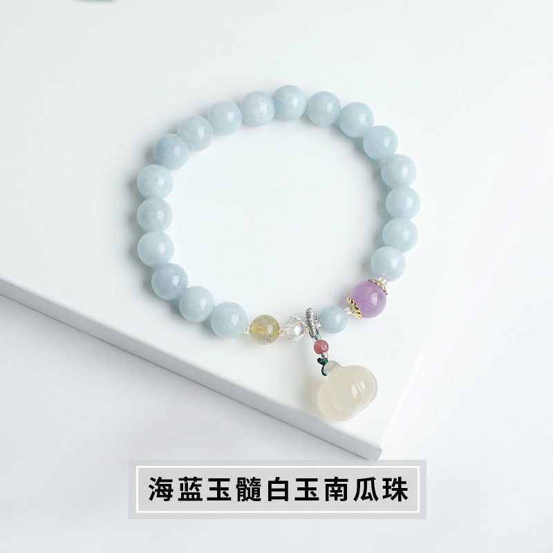 Blue chalcedony bracelet, white jade pumpkin bead pendant.