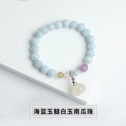 Blue chalcedony bracelet, white jade pumpkin bead pendant.