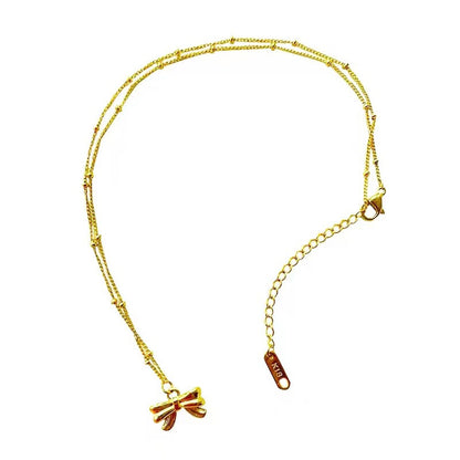 Gold bow anklet