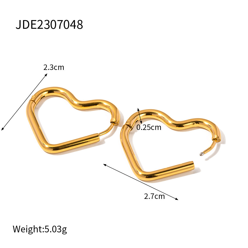 18K gold heart earrings are versatile